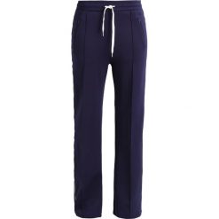 Tiger of Sweden Jeans RADIO Spodnie treningowe maritineblue. Niebieskie spodnie sportowe damskie marki Tiger of Sweden Jeans, m, z elastanu. W wyprzedaży za 359,50 zł.
