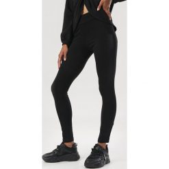 Czarne Legginsy Kelesha. Czarne legginsy damskie Born2be, s, bez wzorów. Za 69,99 zł.