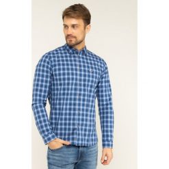 Koszula Tommy Jeans Essential DM0DM06938. Niebieskie koszule męskie Tommy Jeans, xxl, bez wzorów, z jeansu, casualowe, bez kołnierzyka, bez rękawów. W wyprzedaży za 199,00 zł.