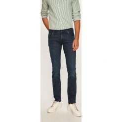 Tommy Hilfiger - Jeansy Denton. Niebieskie jeansy męskie TOMMY HILFIGER, z aplikacjami. W wyprzedaży za 379,90 zł.