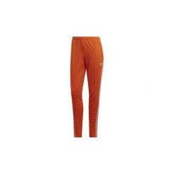 Spodnie treningowe adidas Spodnie dresowe SST. Pomarańczowe spodnie damskie Adidas, z dresówki. Za 199,00 zł.