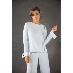 Damska Bluzka z Lamówką Biel. Białe bluzki damskie Veva, z aplikacjami, z materiału, eleganckie, z klasycznym kołnierzykiem, bez rękawów. Za 139,00 zł.