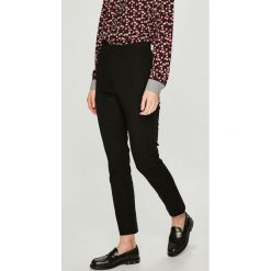 Tommy Hilfiger - Spodnie. Czarne legginsy damskie TOMMY HILFIGER, m, z elastanu, z podwyższonym stanem. W wyprzedaży za 269,90 zł.