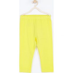 Coccodrillo - Legginsy dziecięce 104-146 cm. Żółte spodnie dziewczęce COCCODRILLO, bez wzorów, z dzianiny. Za 27,90 zł.