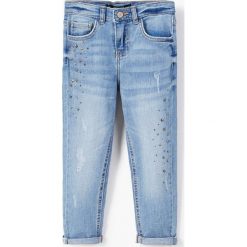Mango Kids - Jeansy dziecięce Caroline 110-164 cm. Niebieskie jeansy dziewczęce marki Mango Kids, z bawełny. W wyprzedaży za 69,90 zł.
