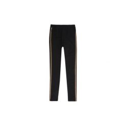 Getry legginsy damskie. Czarne legginsy damskie marki TXM, bez wzorów. Za 24,99 zł.