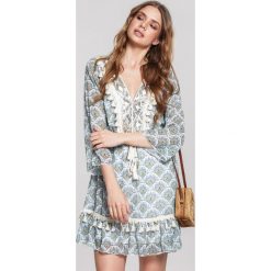 Niebieska Sukienka Whitsun. Niebieskie sukienki damskie other, s, z aplikacjami, klasyczne, z falbankami, bez rękawów, mini. Za 169,99 zł.