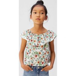 Mango Kids - Top dziecięcy Arena 110-152 cm. Białe bluzki dziewczęce Mango Kids, w kwiaty, z bawełny, z okrągłym kołnierzem, z krótkim rękawem, krótkie, bez kaptura. Za 79,90 zł.