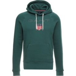 GANT SHIELD HOODIE Bluza z kapturem june bug green. Zielone bluzy męskie rozpinane GANT, m, z bawełny, z kapturem. Za 419,00 zł.