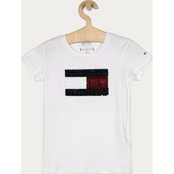 Tommy Hilfiger - T-shirt dziecięcy 110-176 cm. Białe bluzki dziewczęce TOMMY HILFIGER, z aplikacjami, z bawełny, z okrągłym kołnierzem, z krótkim rękawem, krótkie, bez kaptura. Za 139,90 zł.