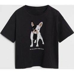 Mango Kids - T-shirt dziecięcy Bull 110-164 cm. Czarne bluzki dziewczęce Mango Kids, z aplikacjami, z bawełny, z okrągłym kołnierzem, z krótkim rękawem, krótkie, bez kaptura. Za 49,99 zł.