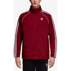 Adidas Originals SST Kurtka Czerwony. Czerwone płaszcze męskie adidas Originals, na wiosnę, xs, bez wzorów, z materiału, bez kaptura. Za 369,95 zł.