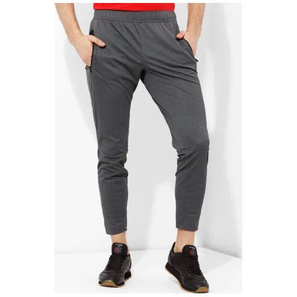 Reebok Spodnie Speedwick Knit Trackster , szary, rozmiar M. Szare spodnie męskie Reebok, na co dzień, m, bez wzorów, z dresówki, sportowe. W wyprzedaży za 199,99 zł.