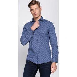 Niebieska Koszula Discharge. Niebieskie koszule męskie Born2be, xl, bez wzorów, biznesowe, z wykładanym kołnierzem, bez rękawów. Za 79,99 zł.