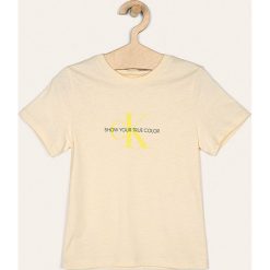 Calvin Klein Jeans - T-shirt dziecięcy 116-176 cm. Białe bluzki dziewczęce Calvin Klein Jeans, z nadrukiem, z bawełny, z okrągłym kołnierzem, z krótkim rękawem, krótkie, bez kaptura. Za 179,90 zł.