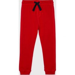 Blukids - Spodnie dziecięce 98-134 cm. Czerwone spodnie chłopięce Blukids, bez wzorów, z bawełny, casualowe. W wyprzedaży za 34,90 zł.
