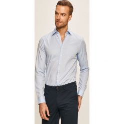 Calvin Klein - Koszula. Białe koszule męskie Calvin Klein, bez wzorów, z elastanu, eleganckie, z klasycznym kołnierzykiem, z długim rękawem. Za 349,90 zł.