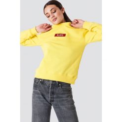 Bluzy damskie: NA-KD Trend Bluza z logo NA-KD – Yellow