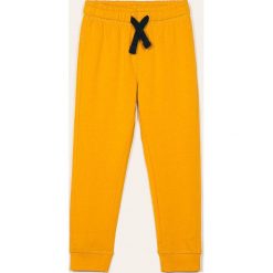 Blukids - Spodnie dziecięce 98-128 cm. Żółte spodnie chłopięce Blukids, bez wzorów, z bawełny, casualowe. Za 39,90 zł.