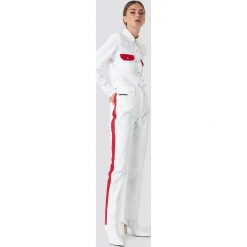 Calvin Klein Spodnie HR Straight Taped - White. Białe spodnie z wysokim stanem marki Calvin Klein, z jeansu, z podwyższonym stanem. W wyprzedaży za 275,58 zł.