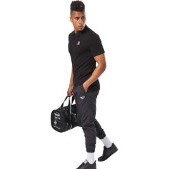 Reebok Polo Koszulka Czarny. Czarne podkoszulki męskie Reebok, s, z bawełny. Za 188,95 zł.