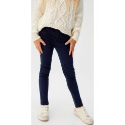 Mango Kids - Jeansy dziecięce Saten 110-164 cm. Różowe jeansy dziewczęce Mango Kids, bez wzorów, z elastanu. W wyprzedaży za 69,90 zł.