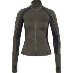 Puma POWERSHAPE Kurtka sportowa olive night. Zielone kurtki sportowe damskie marki Puma, l, z elastanu. W wyprzedaży za 303,20 zł.