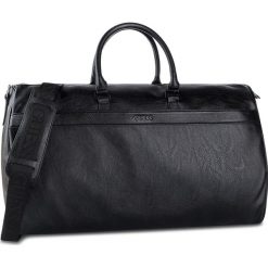 Torba GUESS - City Travel TM6718 POL93 BLA. Czarne torby męskie skórzane Guess, z aplikacjami. W wyprzedaży za 559,00 zł.
