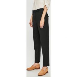 Calvin Klein - Spodnie. Czarne spodnie damskie Calvin Klein, s, bez wzorów, z elastanu, eleganckie. W wyprzedaży za 439,90 zł.