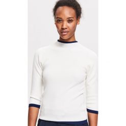 Sweter ze stójką - Kremowy. Białe swetry damskie marki Reserved, s, bez wzorów, bez rękawów, bez kaptura. Za 59,99 zł.