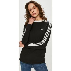 Adidas Originals - Bluzka. Czarne topy damskie adidas Originals, z aplikacjami, z elastanu, casualowe, z okrągłym kołnierzem. W wyprzedaży za 129,90 zł.
