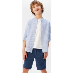 Mango Kids - Koszula dziecięca Form 110-164 cm. Niebieskie koszule chłopięce Mango Kids, bez wzorów, z bawełny, casualowe, ze stójką, z długim rękawem, długie. W wyprzedaży za 55,90 zł.