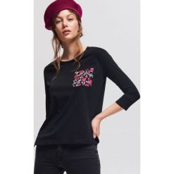T-shirt z nadrukiem - Czarny. Czarne t-shirty damskie marki Reserved, l, z nadrukiem. W wyprzedaży za 19,99 zł.