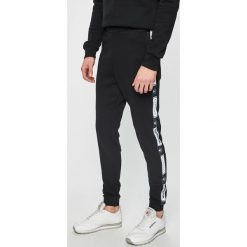 Reebok Classic - Spodnie. Czarne spodnie męskie marki Reebok Classic, na co dzień, s, bez wzorów, z bawełny, casualowe. Za 269,90 zł.