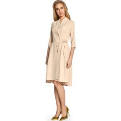 Sukienka na zakładkę s099. Brązowe sukienki damskie marki Style, do pracy, s, bez wzorów, eleganckie, z asymetrycznym kołnierzem, bez rękawów, asymetryczne. W wyprzedaży za 109,00 zł.