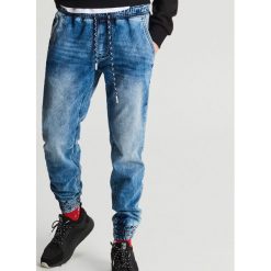 Jeansy slim jogger - Granatowy. Niebieskie jeansy męskie Cropp, m, bez wzorów. Za 99,99 zł.
