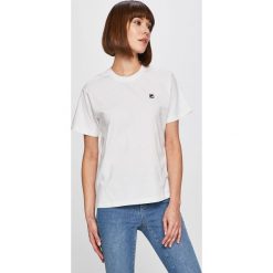 Fila - Top. Pomarańczowe bluzki damskie Fila, s, bez wzorów, z bawełny, z okrągłym kołnierzem, z krótkim rękawem. W wyprzedaży za 79,90 zł.
