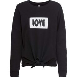 Bluza z ozdobnym przewiązaniem bonprix czarno-biały z nadrukiem. Czarne bluzy damskie bonprix, z nadrukiem, bez rękawów, bez kaptura. Za 49,99 zł.