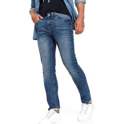 Spodnie denim slim fit. Niebieskie spodnie męskie Top Secret, na co dzień, na zimę, m, bez wzorów, z jeansu, sportowe. W wyprzedaży za 49,99 zł.
