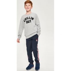 Bluza z aplikacją - Jasny szar. Szare bluzy chłopięce rozpinane marki DOMYOS. Za 89,99 zł.