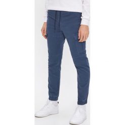 Spodnie jogger z kieszenią - Granatowy. Niebieskie spodnie męskie House, s, bez wzorów. Za 129,99 zł.