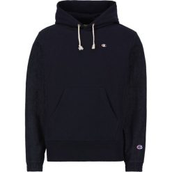 Bluza Champion Denim 214496. Niebieskie bluzy męskie Champion, s, bez wzorów, z bawełny, bez kołnierzyka, bez rękawów, bez kaptura. W wyprzedaży za 419,00 zł.