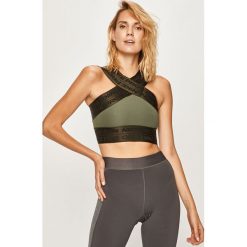 Nike - Top sportowy. Zielone topy damskie Nike, s, z aplikacjami, z elastanu, z dekoltem karo. W wyprzedaży za 159,90 zł.