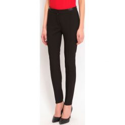 LEGGINSY DAMSKIE. Czarne legginsy damskie marki Top Secret. W wyprzedaży za 69,99 zł.