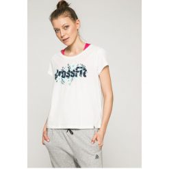 Reebok - Top. Białe topy damskie marki Reebok, s, z nadrukiem, z bawełny, z okrągłym kołnierzem. W wyprzedaży za 69,90 zł.