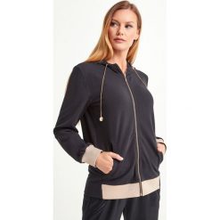 BLUZA LIU JO SPORT. Żółte bluzy sportowe damskie Liu Jo Sport, xl, bez wzorów, z elastanu, bez rękawów, z kapturem. Za 689,00 zł.