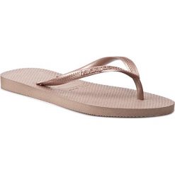 Japonki HAVAIANAS - Slim 4000303581 Rose Gold. Żółte klapki damskie Havaianas, bez wzorów, z tworzywa sztucznego, bez obcasa. Za 99,00 zł.