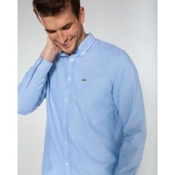 Lacoste Koszula Niebieski. Niebieskie koszule męskie Lacoste, m, bez wzorów, z bawełny, bez kołnierzyka, z długim rękawem. Za 404,95 zł.