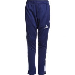 Adidas Performance CORE Spodnie treningowe dark blue/white. Różowe spodnie chłopięce marki adidas Performance, z dzianiny, z okrągłym kołnierzem. Za 129,00 zł.