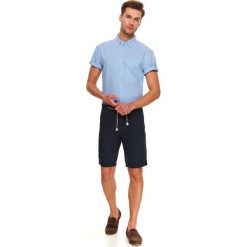 Koszula krótki rękaw męska regular fit. Niebieskie koszule męskie Top Secret, s, bez wzorów, eleganckie, bez kołnierzyka, z krótkim rękawem. W wyprzedaży za 69,99 zł.
